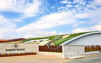 The Bodegas Ramón Bilbao winery in the Spanish wine-growing region of Rioja Alta receives visitors to its unique green roofed building. Pitched green roof